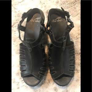 New!! Never worn. Dansko black leather sandal